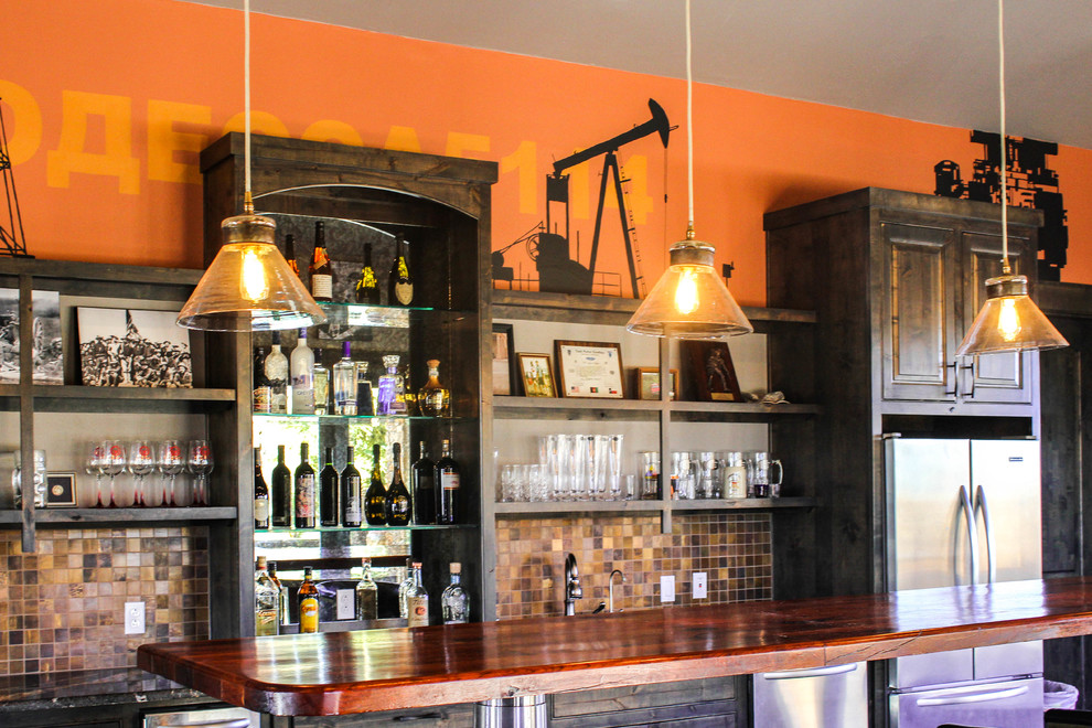 This is an example of an eclectic home bar in Austin.