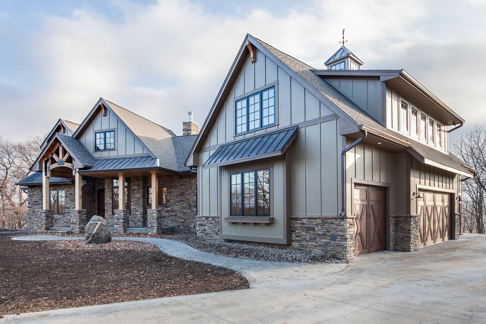 Large rustic beige two-story mixed siding exterior home idea