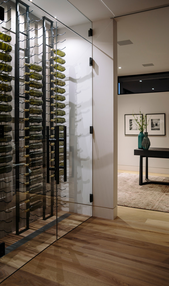 Inspiration for a large contemporary wine cellar in Vancouver with medium hardwood floors.