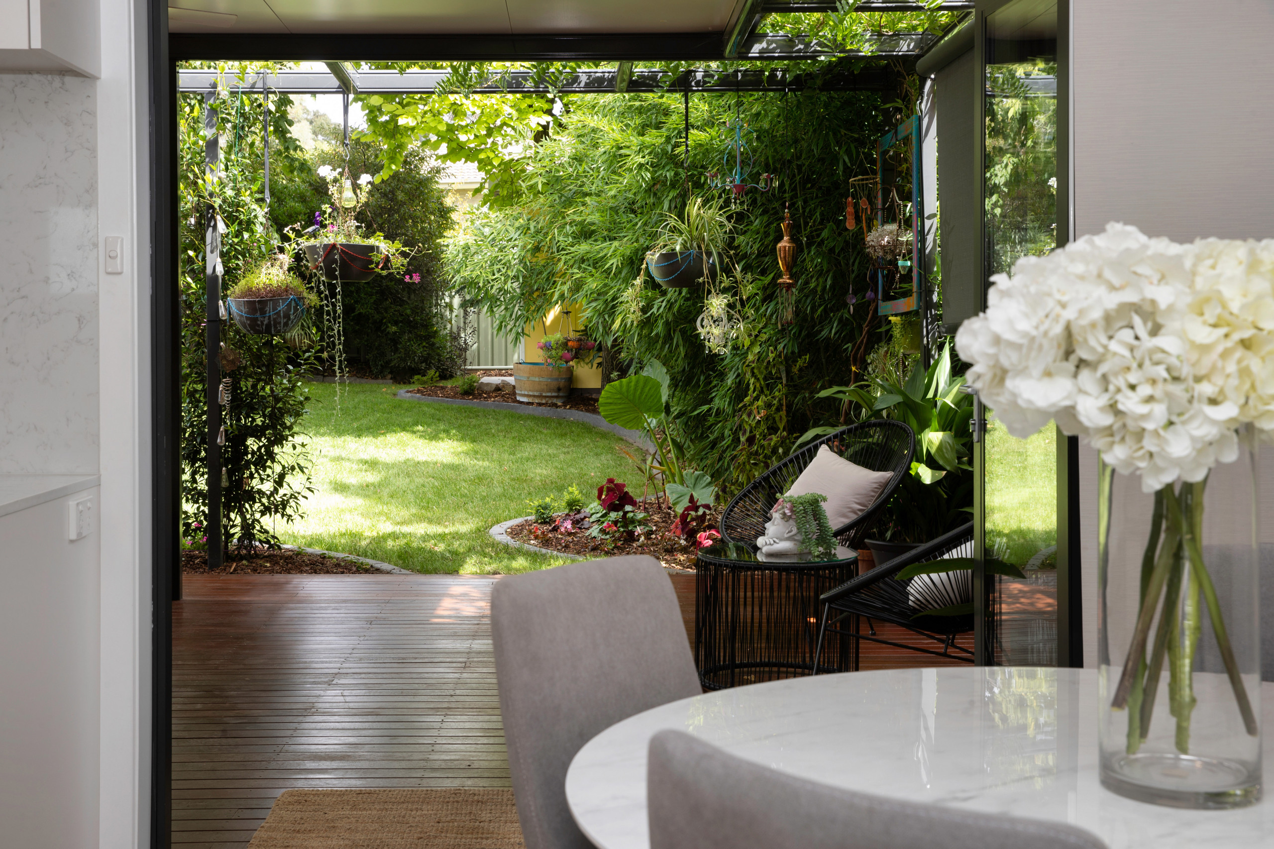 The rear was opened up to encourage connection to the newly landscaped green spaces, using this to make the small space feel larger, but also playing on biophilic design principles of integrating gree