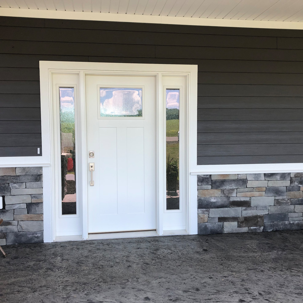 Foto de puerta principal de estilo americano grande con paredes negras, puerta simple y puerta blanca