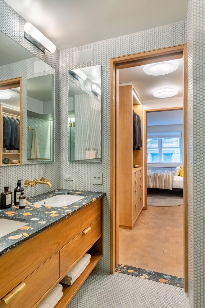 Mid-sized midcentury master bathroom in New York with medium wood cabinets, an alcove shower, a wall-mount toilet, green tile, porcelain tile, grey walls, porcelain floors, an undermount sink, engineered quartz benchtops, green floor, a hinged shower door, orange benchtops, a double vanity and a built-in vanity.