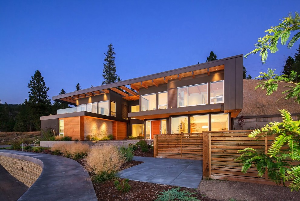 Inspiration for a contemporary two-storey brown exterior in Calgary.