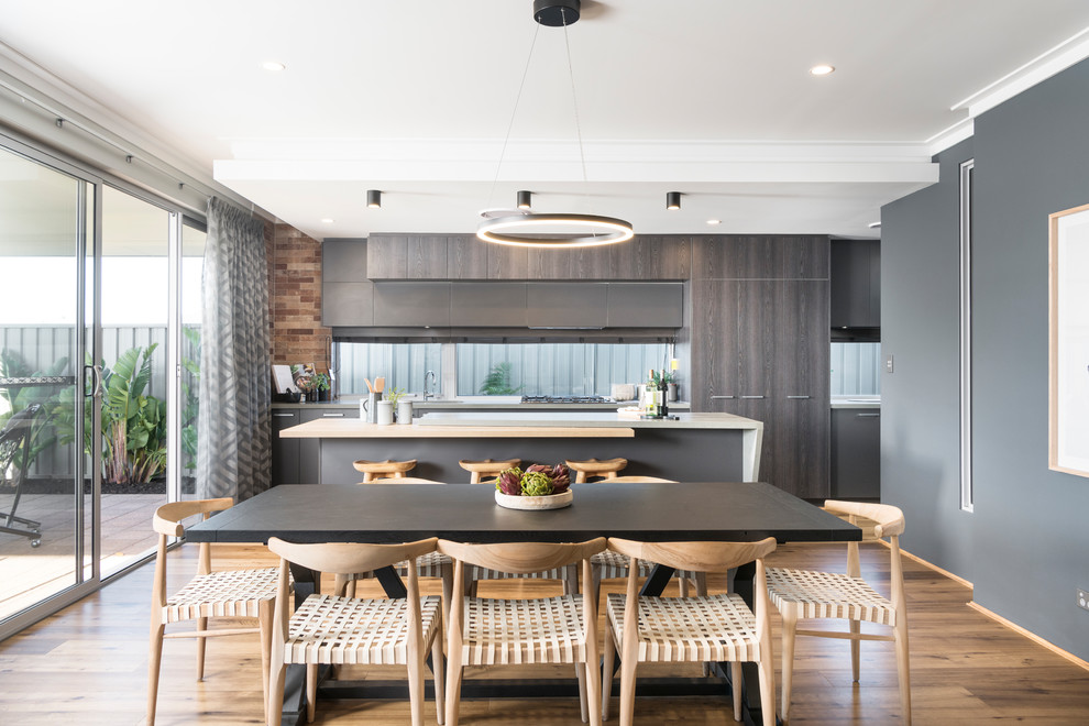 Inspiration for a beach style kitchen/dining combo in Perth with light hardwood floors, beige floor and grey walls.