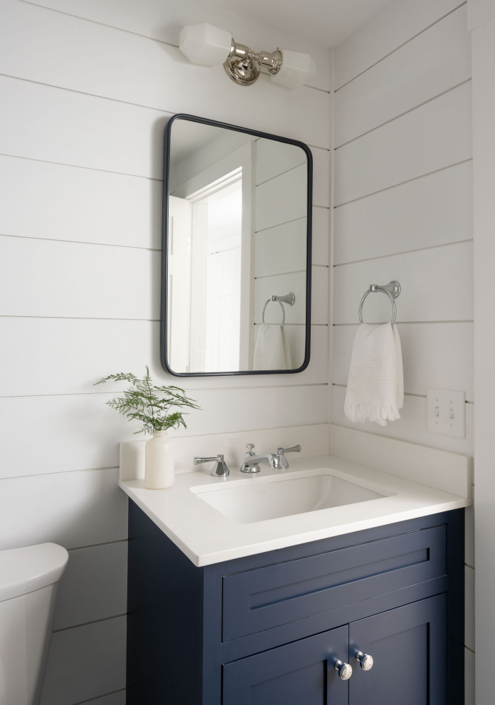 Example of a beach style powder room design in Boston
