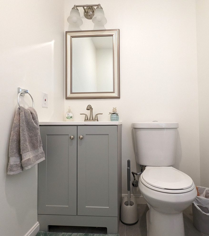 This is an example of a traditional powder room in Other.