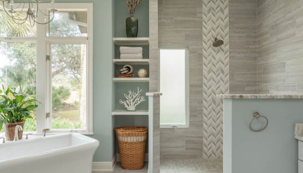 Photo of a large beach style master bathroom in Atlanta with recessed-panel cabinets, white cabinets, a freestanding tub, an open shower, beige tile, stone tile, green walls, an undermount sink, an open shower and multi-coloured benchtops.