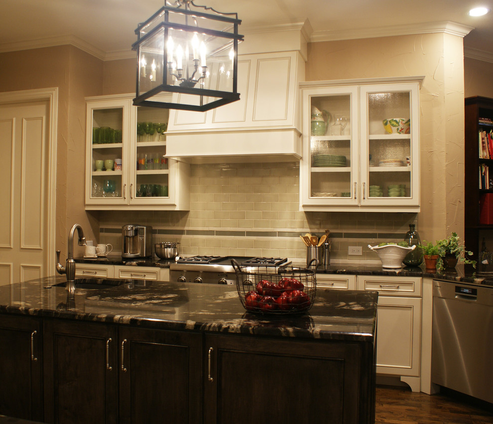 Inspiration for a transitional medium tone wood floor kitchen remodel in Dallas with an undermount sink, flat-panel cabinets, white cabinets, granite countertops, beige backsplash, ceramic backsplash, stainless steel appliances, beige walls and an island