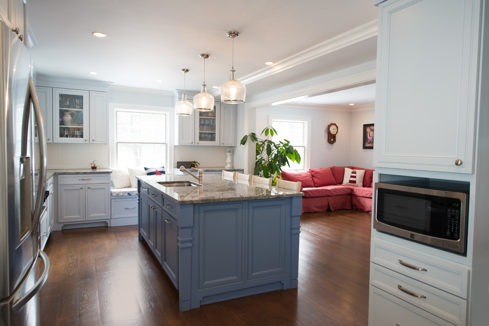 Inspiration for a transitional kitchen remodel in New York with wood backsplash