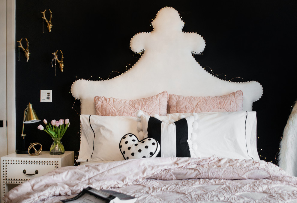 Inspiration for a mid-sized eclectic bedroom in Boise with black walls and carpet.