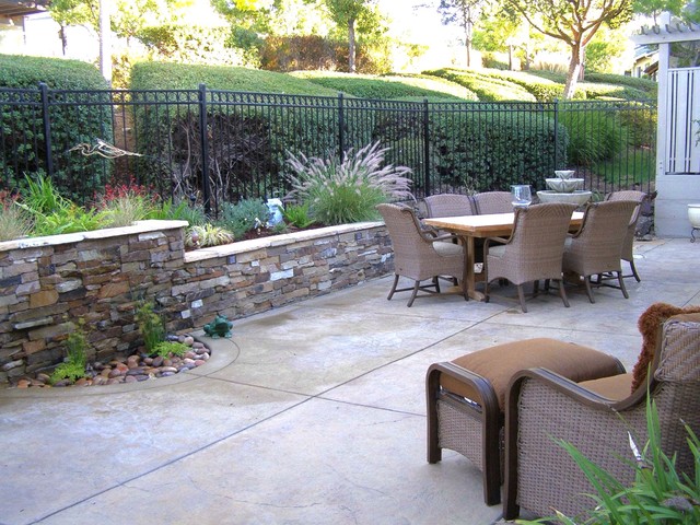 Evergreen Villages Stained Concrete Patio And Seat Wall With