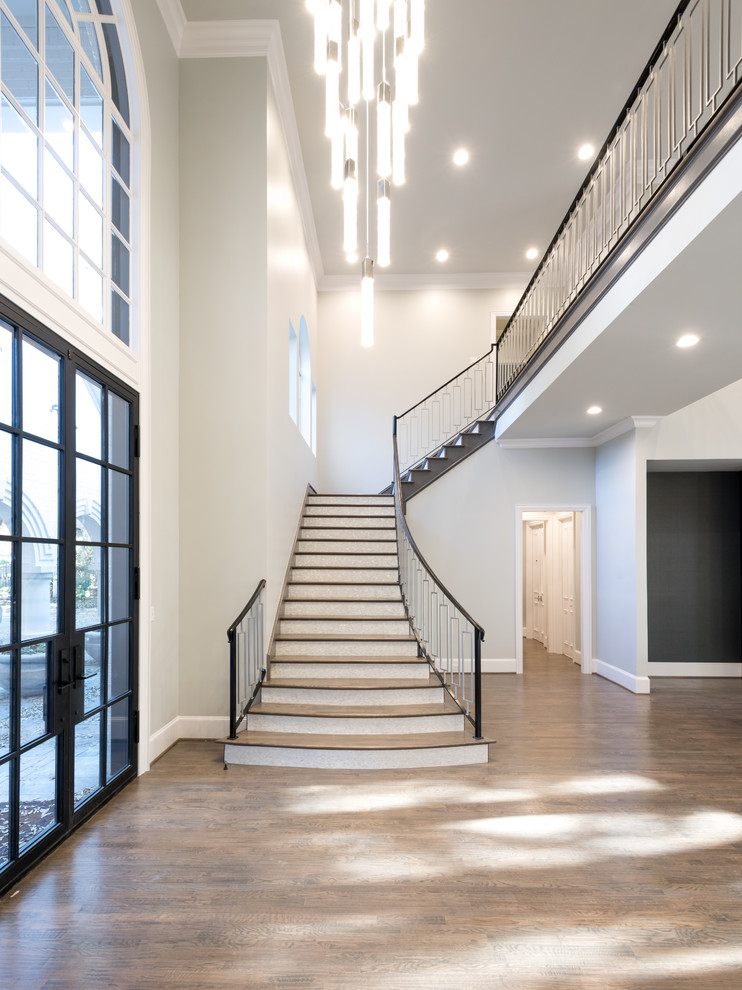 Inspiration for an expansive transitional wood l-shaped staircase in Dallas with mixed railing and tile risers.