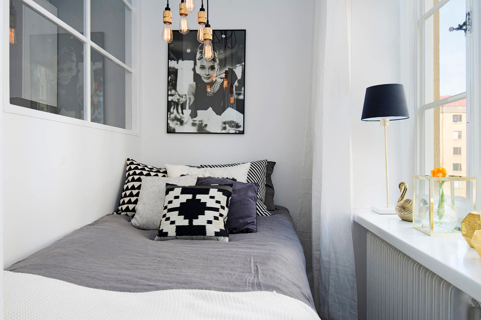 Inspiration for a small scandinavian guest bedroom in Stockholm with white walls.