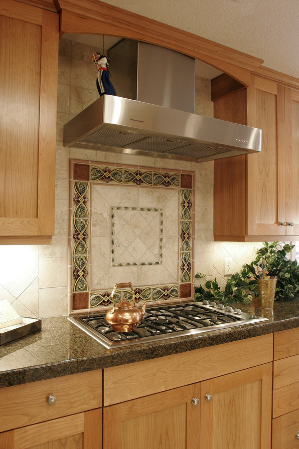 Photo of a mid-sized traditional galley open plan kitchen in Portland with shaker cabinets, light wood cabinets, granite benchtops, multi-coloured splashback, ceramic splashback and stainless steel appliances.