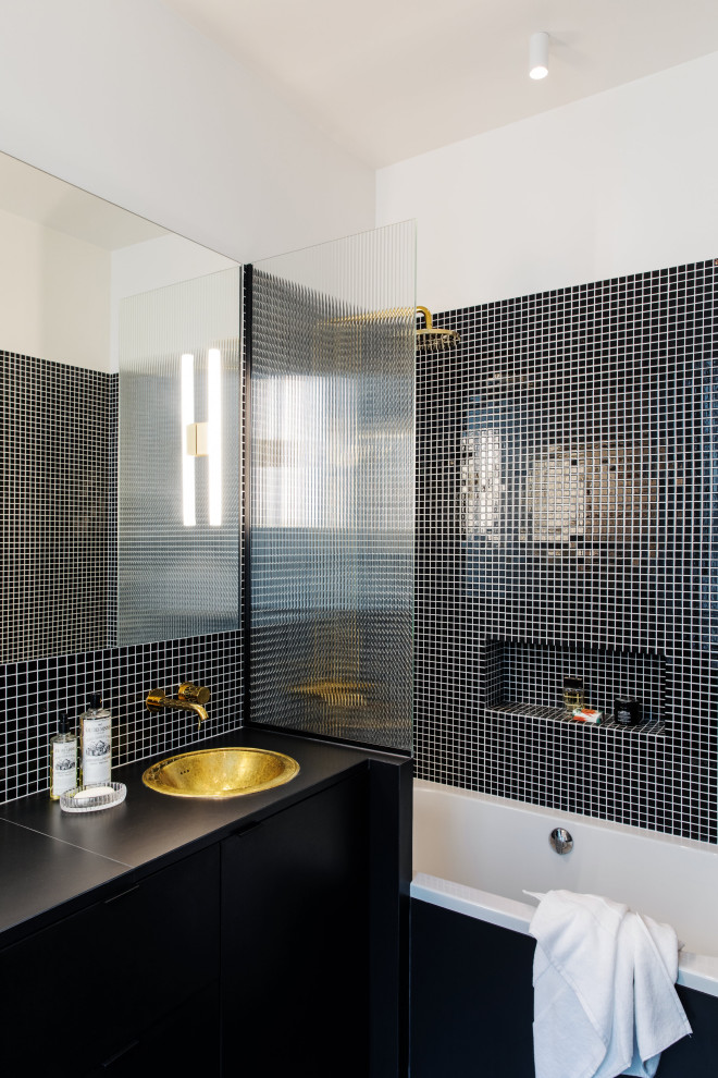 Medium sized traditional ensuite bathroom in Paris with beaded cabinets, black cabinets, a submerged bath, black tiles, ceramic tiles, white walls, ceramic flooring, a submerged sink, tiled worktops, black floors, black worktops, double sinks and a floating vanity unit.