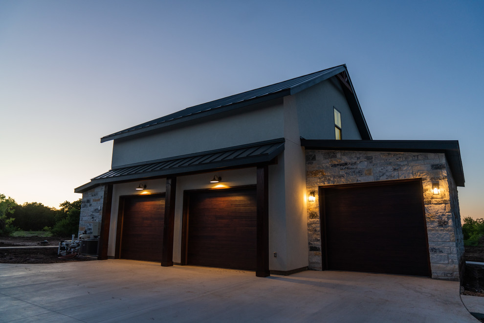 This is an example of a large country detached three-car garage in Austin.