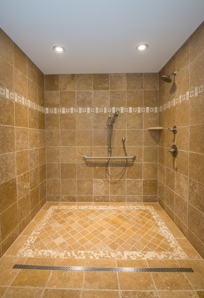 Inspiration for a large traditional master bathroom in New York with an open shower and beige tile.