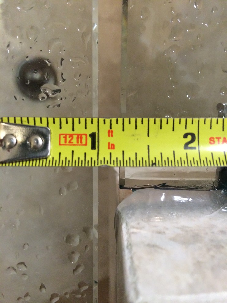 Frameless glass shower door gap