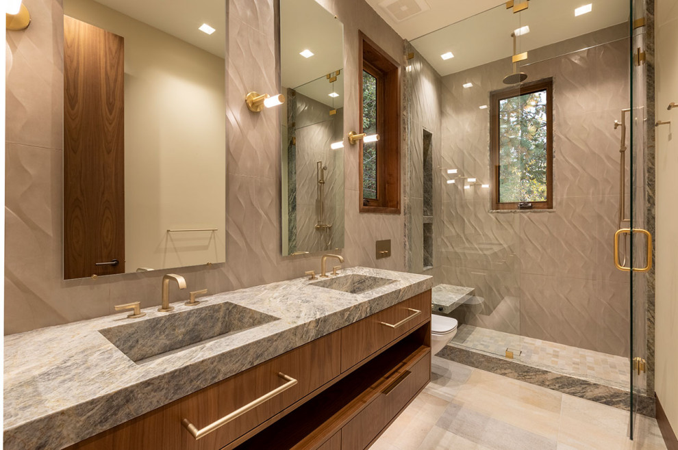 Mid-sized contemporary bathroom in Other with flat-panel cabinets, brown cabinets, a corner shower, brown tile, stone tile, brown walls, an integrated sink, quartzite benchtops, multi-coloured floor, a hinged shower door, multi-coloured benchtops, a shower seat, a double vanity and a built-in vanity.