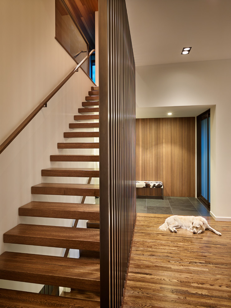 Midcentury wood straight staircase in Seattle with open risers.