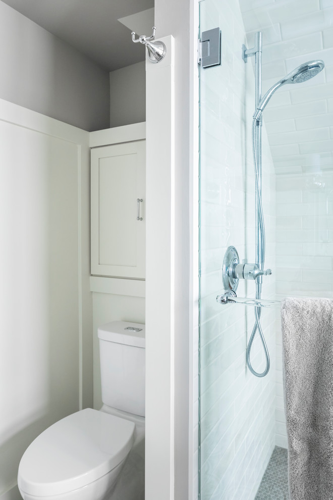 Example of a mid-sized transitional master white tile and ceramic tile ceramic tile and gray floor freestanding bathtub design in Seattle with a two-piece toilet, white walls, an undermount sink, quartz countertops and a hinged shower door