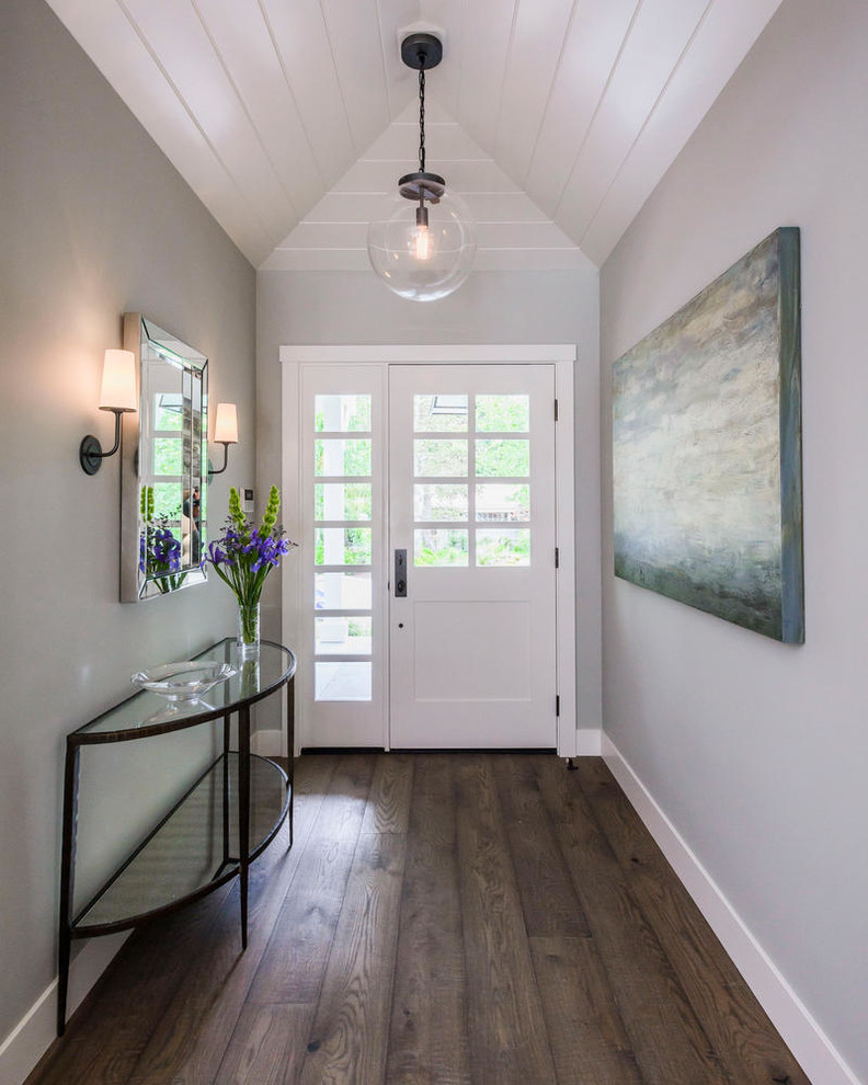Design ideas for a mid-sized transitional foyer in San Francisco with grey walls, dark hardwood floors, a single front door and a white front door.