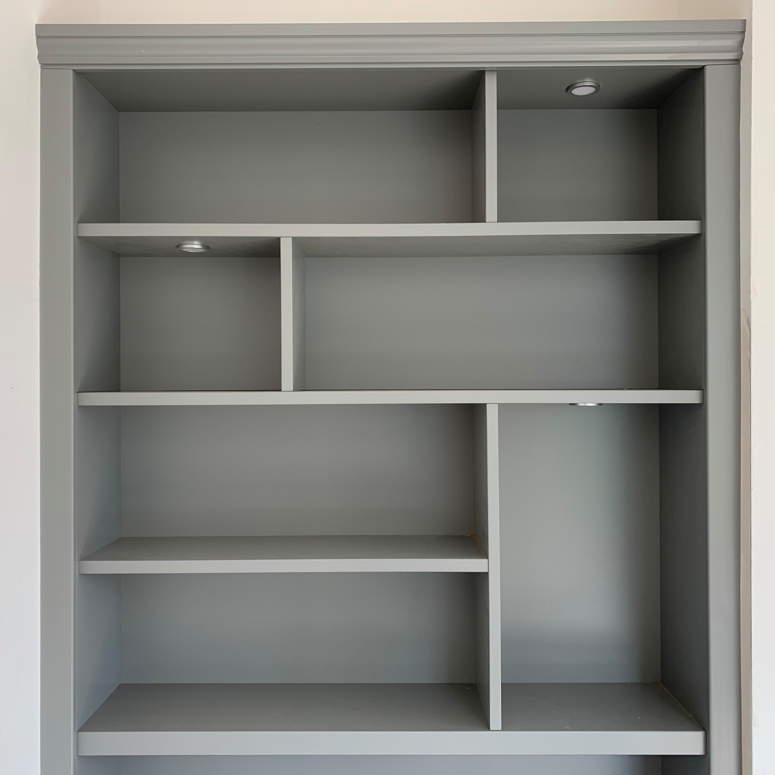 Classic grey bookcase shelving with lighting and dividers
