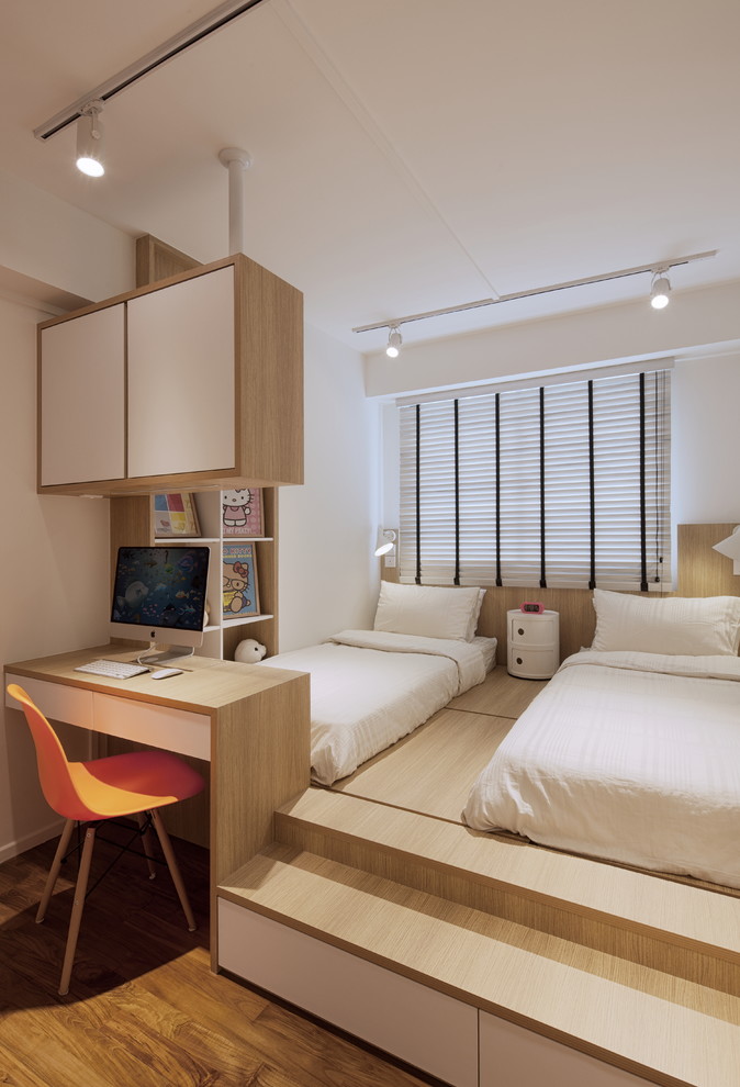 Design ideas for a contemporary gender-neutral kids' bedroom for kids 4-10 years old in Singapore with white walls, medium hardwood floors and brown floor.
