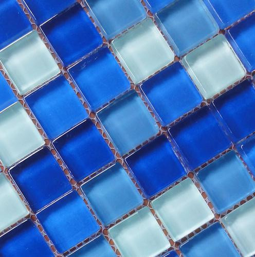 Example of a courtyard tile and custom-shaped aboveground pool design