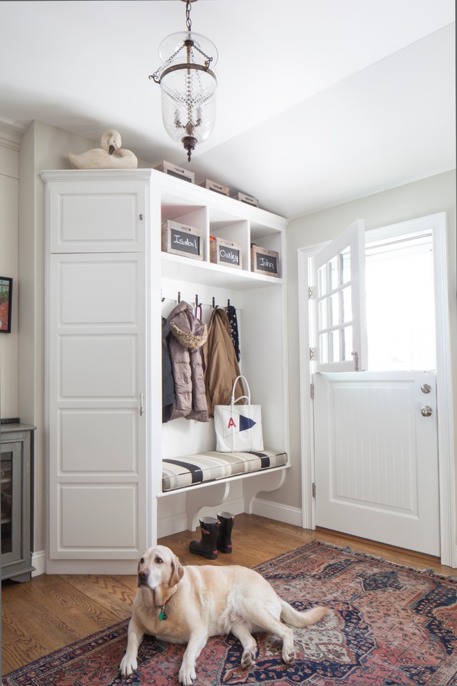 Inspiration for a mid-sized country mudroom in Portland Maine with white walls, medium hardwood floors, a dutch front door and a white front door.