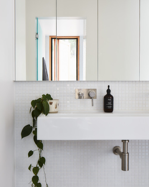 Effortless Elegance: Serene Modern Bathroom with White Mosaic Backsplash