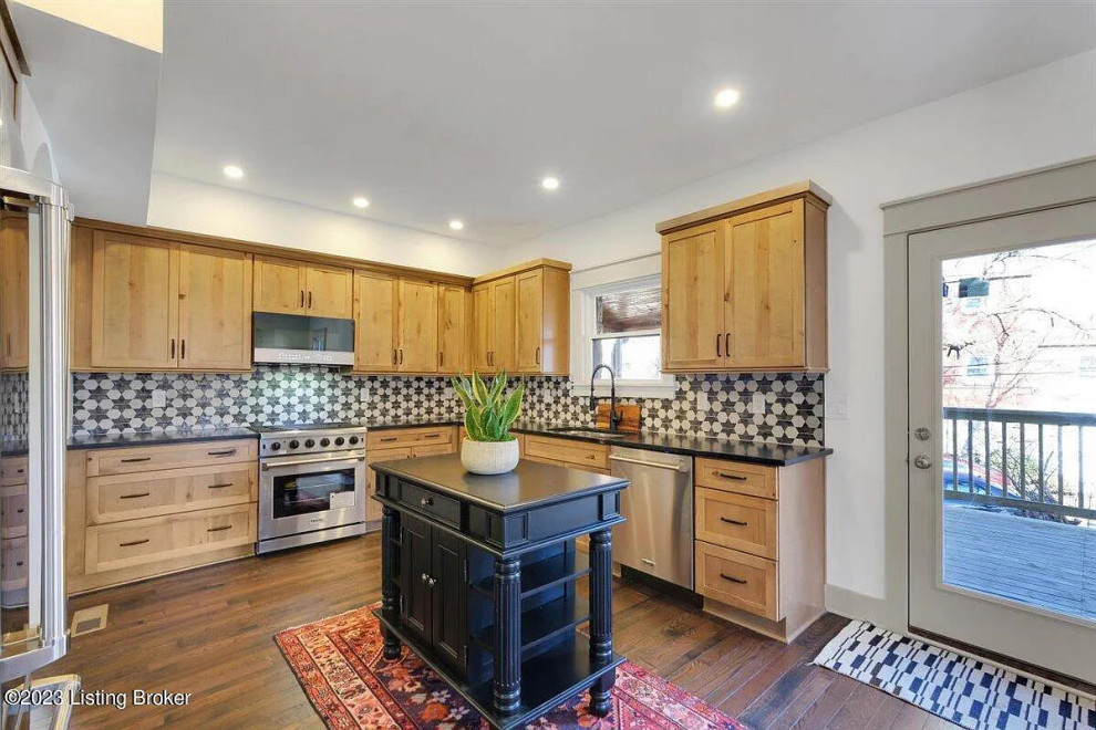 Kitchen - mid-sized transitional l-shaped medium tone wood floor kitchen idea with an undermount sink, shaker cabinets, light wood cabinets and an island