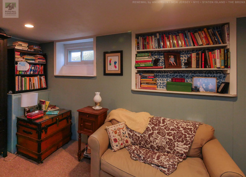 Example of a mid-sized underground carpeted and beige floor basement design in Newark with green walls and no fireplace
