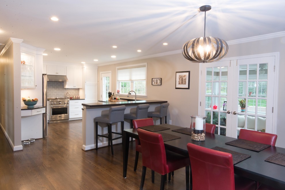 Inspiration for a transitional eat-in kitchen remodel in Baltimore with white cabinets, gray backsplash, glass tile backsplash, stainless steel appliances and no island