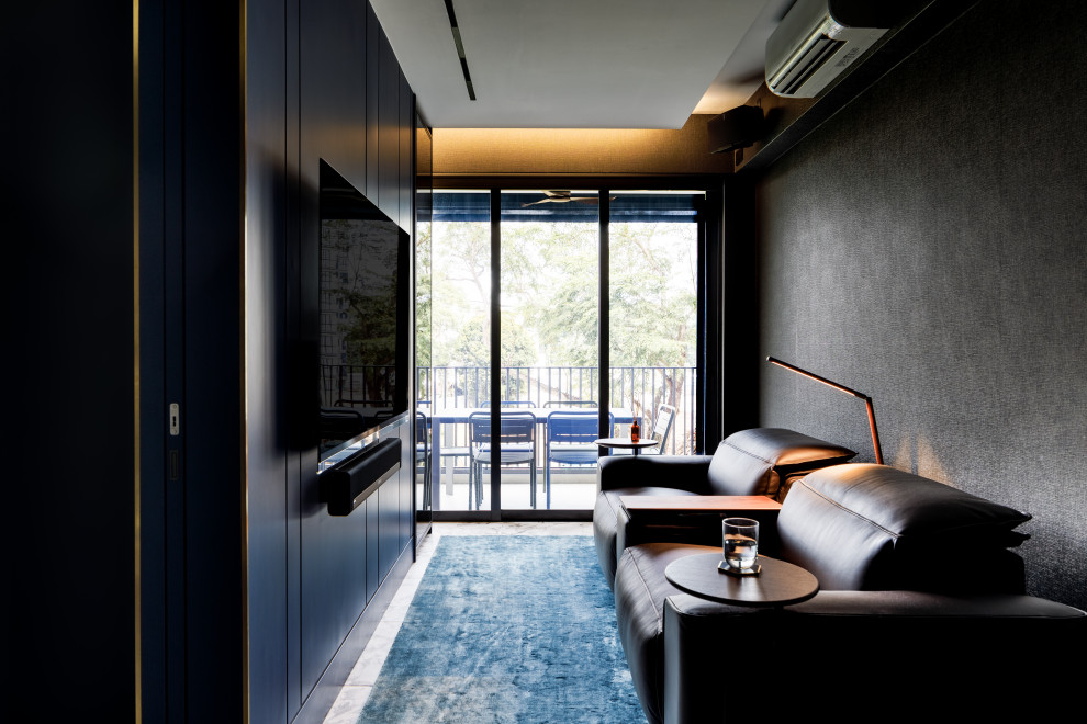 Small contemporary enclosed family room in Singapore with black walls, a wall-mounted tv and wallpaper.