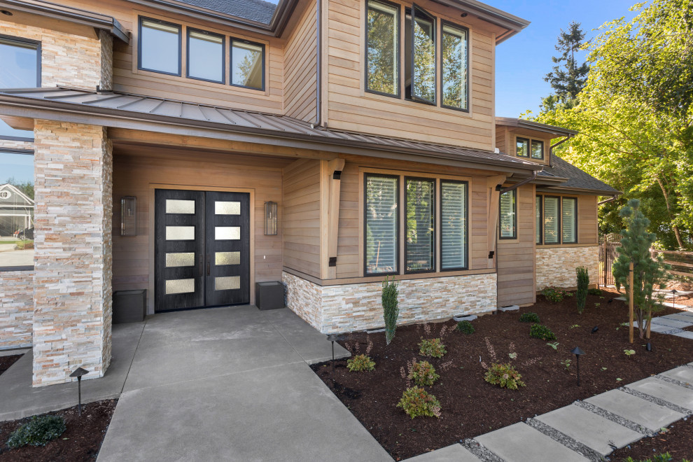 This is an example of a large modern two-storey brown house exterior in Los Angeles with wood siding.