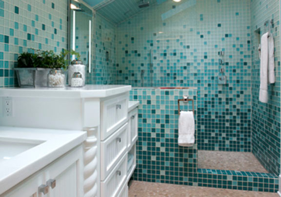 This is an example of a mid-sized contemporary 3/4 bathroom in Portland with an alcove shower, blue walls, pebble tile floors, an undermount sink, louvered cabinets, white cabinets and engineered quartz benchtops.