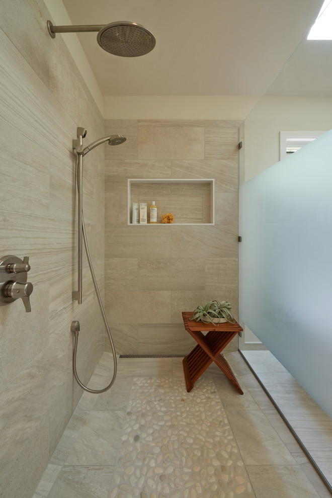 Photo of a mid-sized transitional master bathroom in Seattle with flat-panel cabinets, medium wood cabinets, a freestanding tub, a curbless shower, a one-piece toilet, white tile, porcelain tile, white walls, porcelain floors, an undermount sink and engineered quartz benchtops.