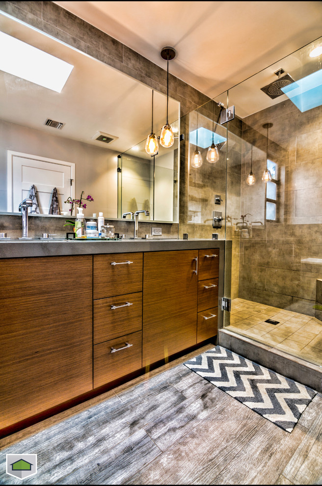 Design ideas for a mid-sized modern master bathroom in San Francisco with flat-panel cabinets, dark wood cabinets, a corner shower, beige tile, ceramic tile and grey walls.