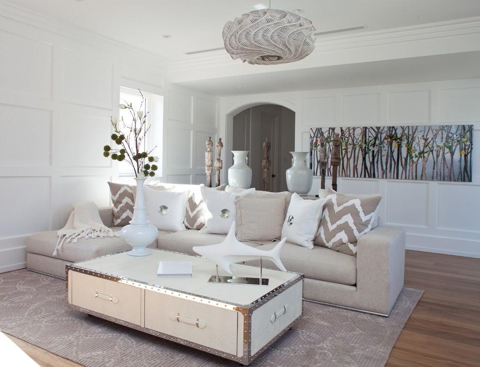 Design ideas for a contemporary living room in Miami with white walls and light hardwood floors.