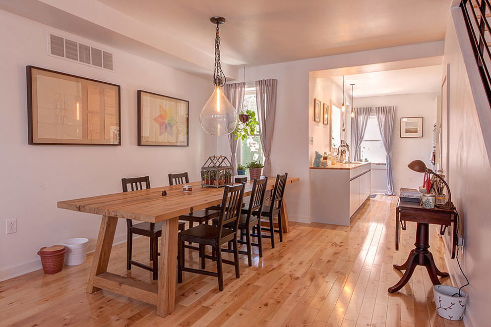 Example of a small urban light wood floor kitchen/dining room combo design in Philadelphia with white walls
