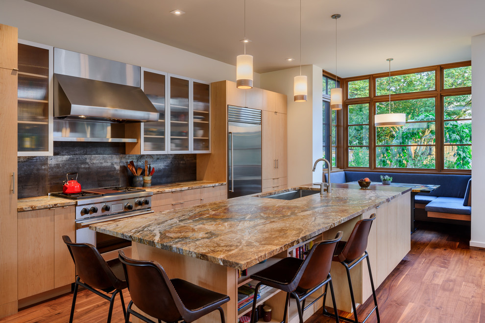 Inspiration for a large contemporary eat-in kitchen in Seattle with an undermount sink, flat-panel cabinets, light wood cabinets, metallic splashback, stainless steel appliances, medium hardwood floors, with island, multi-coloured benchtop, marble benchtops, metal splashback and brown floor.