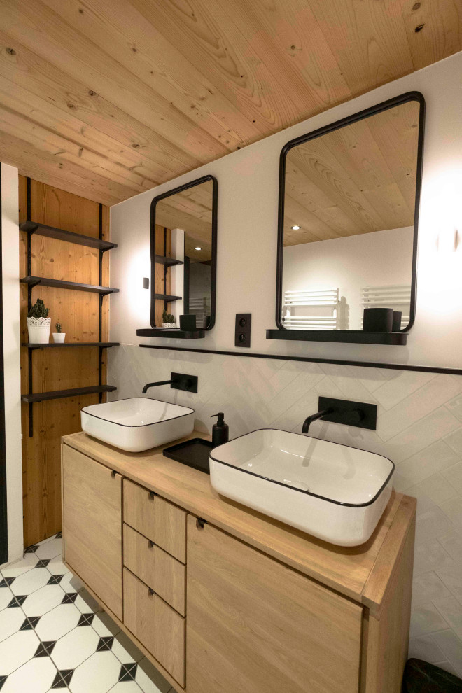 This is an example of a small rustic shower room bathroom in Lyon with a built-in shower, brown tiles, wood-effect tiles, white walls, cement flooring, a console sink, wooden worktops, white floors, a hinged door, brown worktops, double sinks, a freestanding vanity unit, a wood ceiling and all types of wall treatment.