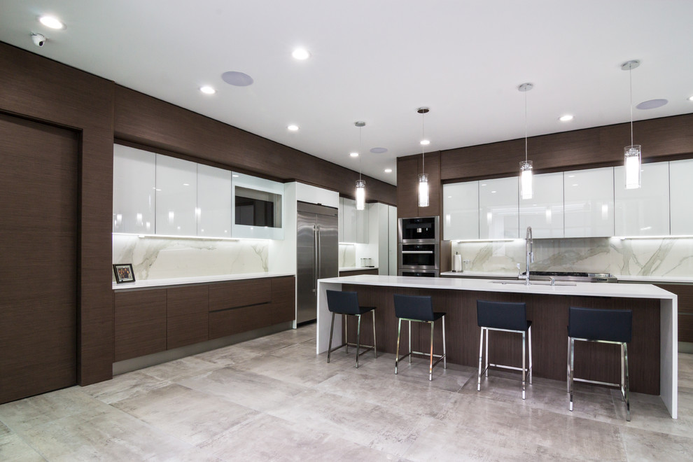 This is an example of a large contemporary u-shaped open plan kitchen in Dallas with an undermount sink, glass-front cabinets, dark wood cabinets, quartz benchtops, white splashback, stone slab splashback, stainless steel appliances, porcelain floors and multiple islands.