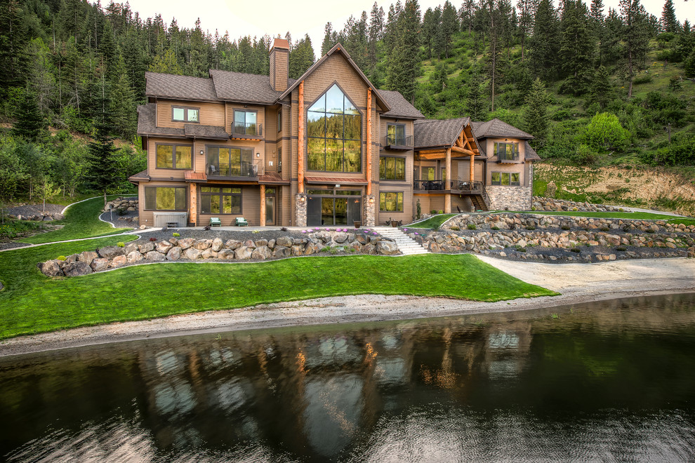 Rustic three-story wood exterior home idea in Seattle