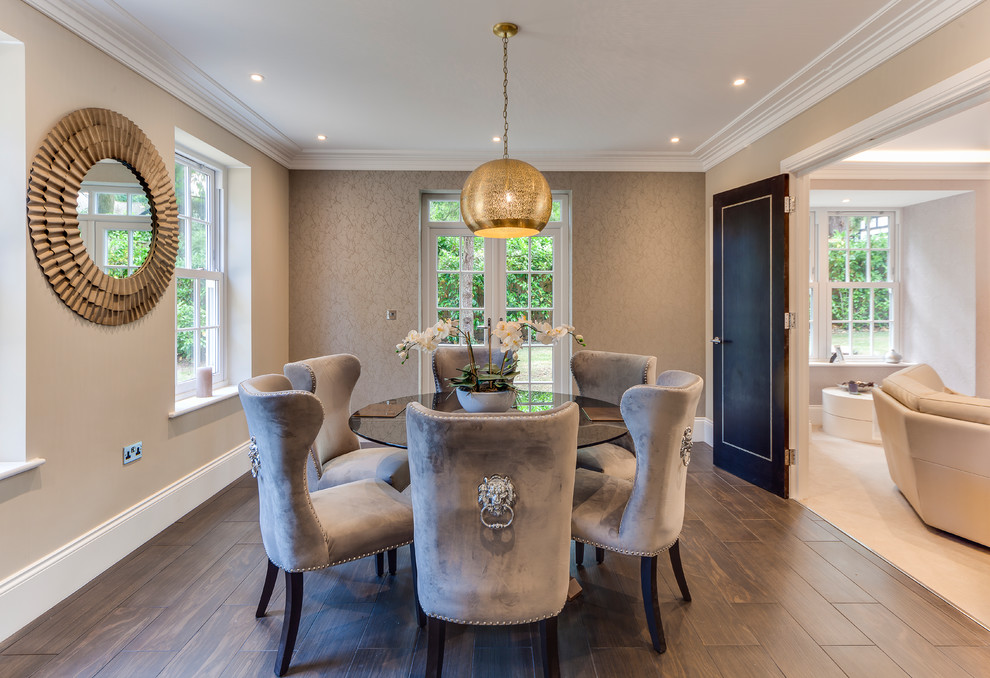Design ideas for a mid-sized contemporary dining room in Surrey with beige walls, dark hardwood floors and brown floor.