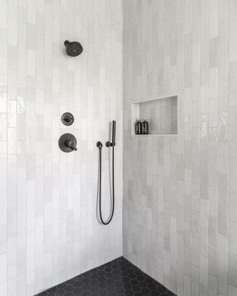 Example of a large minimalist master white tile and ceramic tile ceramic tile and black floor bathroom design in Austin with white walls, a niche and a built-in vanity