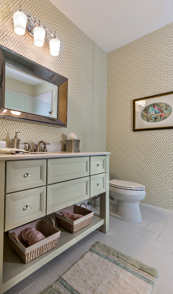 Design ideas for a small transitional 3/4 bathroom in Miami with recessed-panel cabinets, green cabinets, a one-piece toilet, white tile, ceramic tile, multi-coloured walls, ceramic floors, an undermount sink and solid surface benchtops.