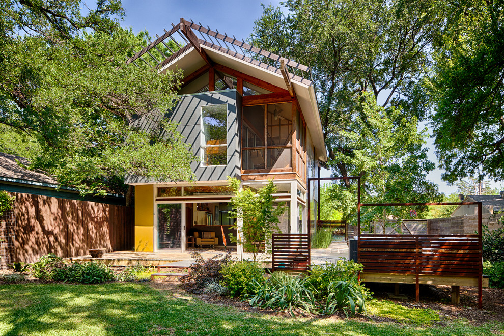 Inspiration for a contemporary exterior in Dallas with wood siding.