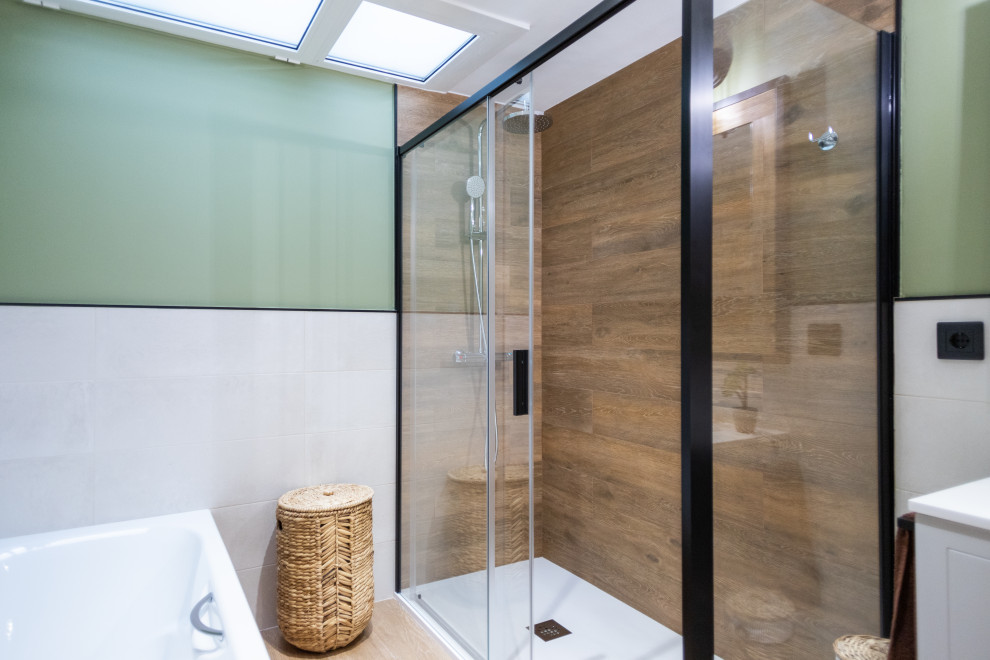 This is an example of a large mediterranean master bathroom in Barcelona with raised-panel cabinets, beige cabinets, an alcove tub, a curbless shower, a two-piece toilet, white tile, ceramic tile, green walls, ceramic floors, brown floor, a sliding shower screen, white benchtops, an enclosed toilet, a double vanity and a built-in vanity.